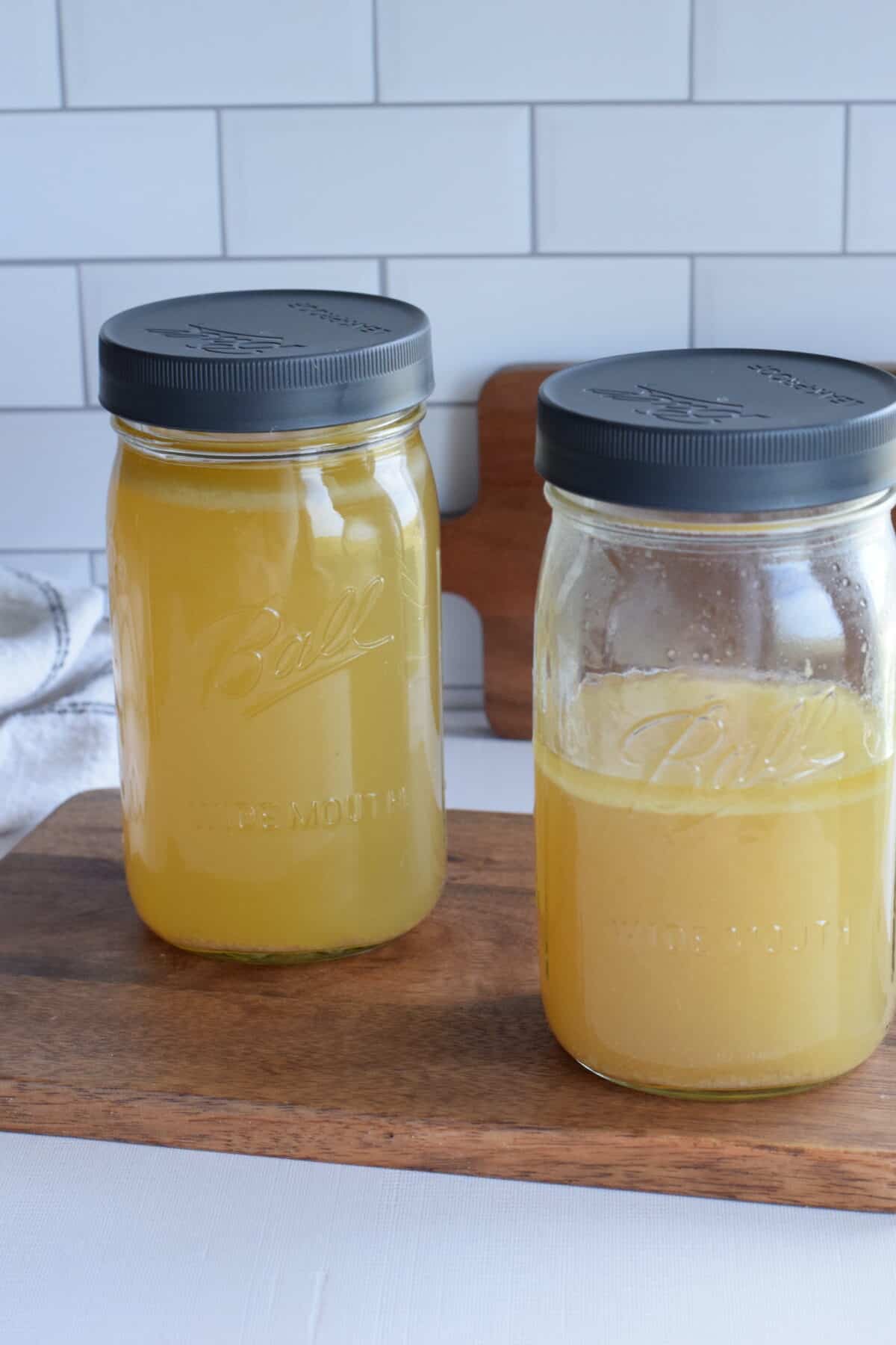 two mason jars filled with homemade bone broth. 