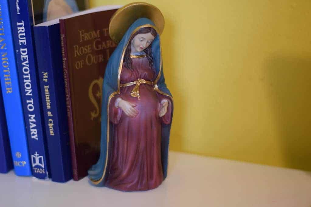 Blessed Mother statue displayed on a desk