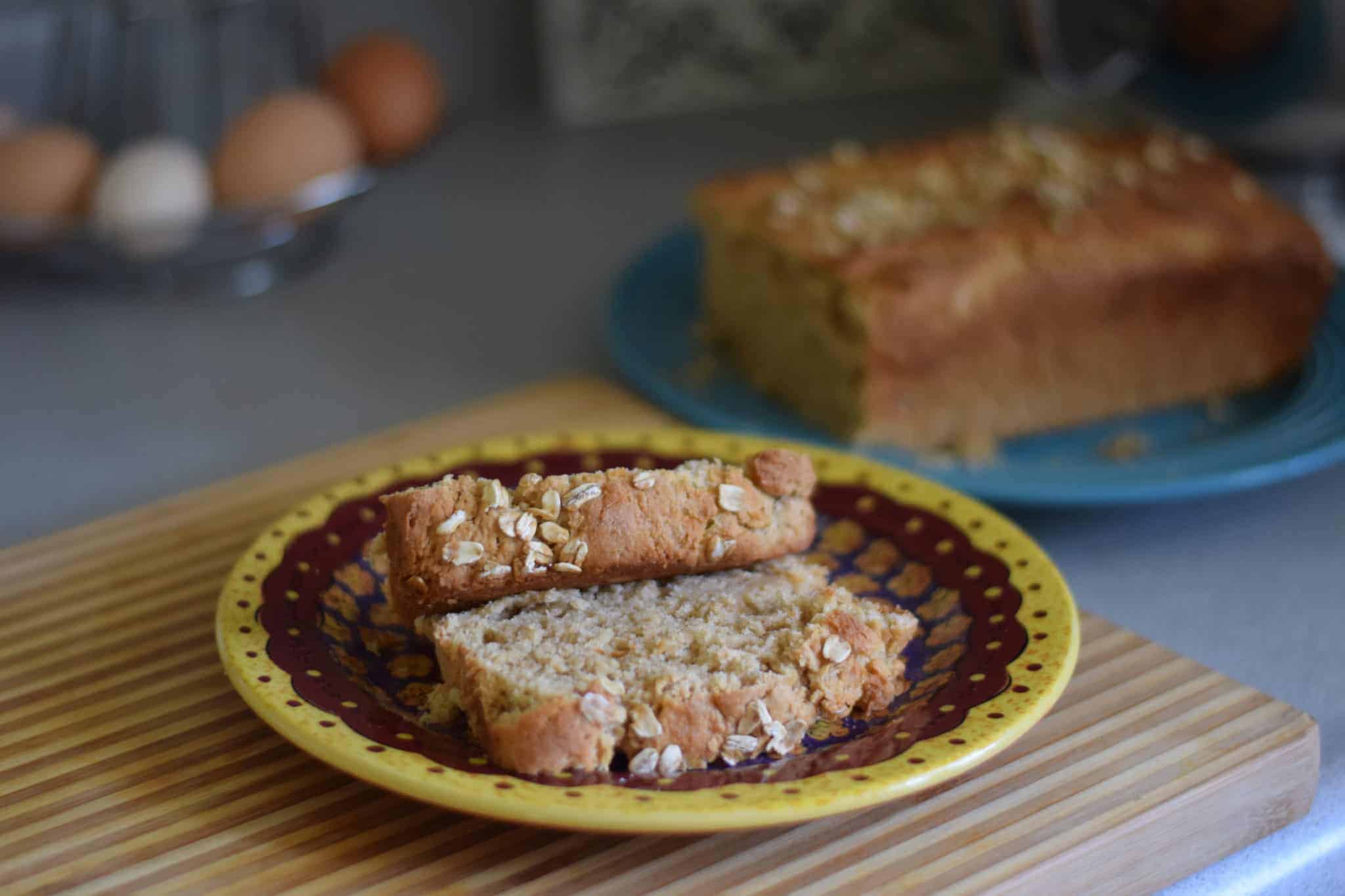 fresh baked bread loaf and slices of bread on a plate