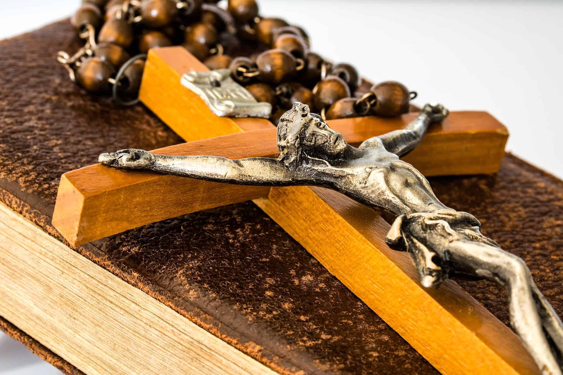 large crucifix on a rosary and prayer book