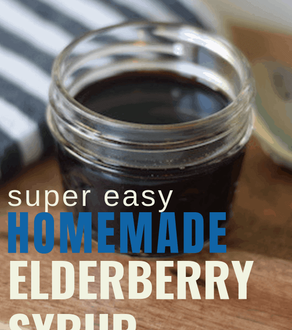 homemade elderberry syrup in a small glass mason jar