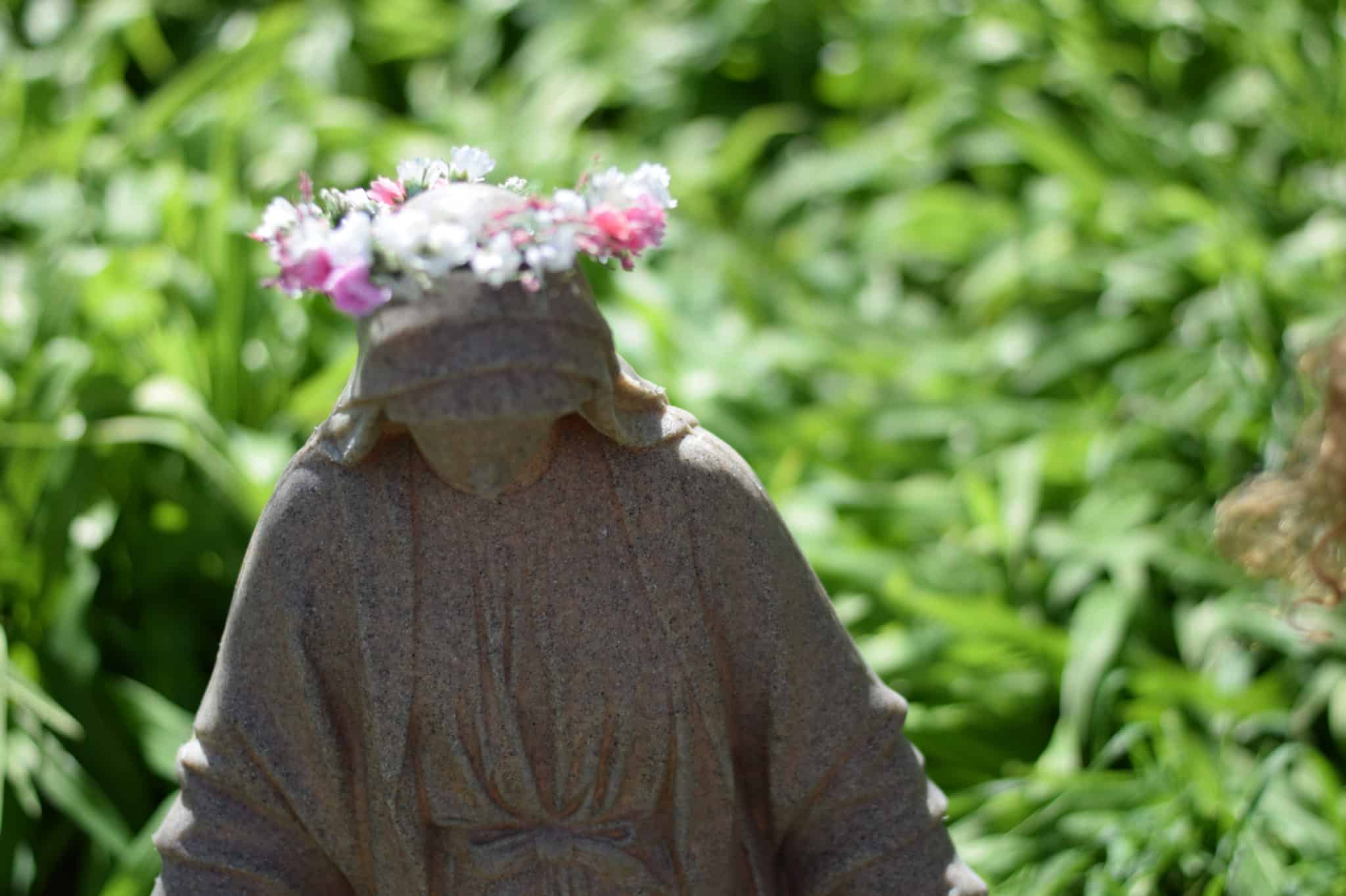 outdoor Mary statue with flower crown 