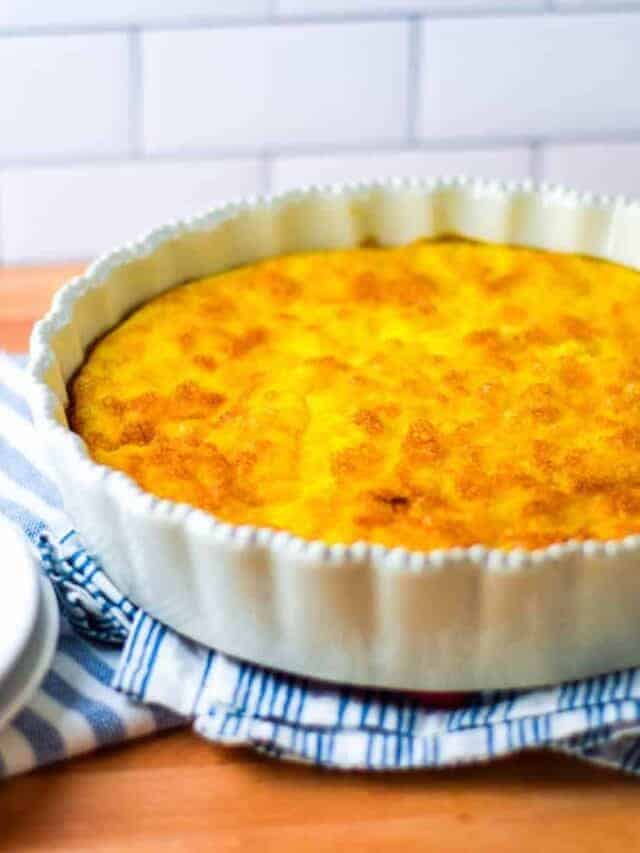 finished quiche in a white pie dish