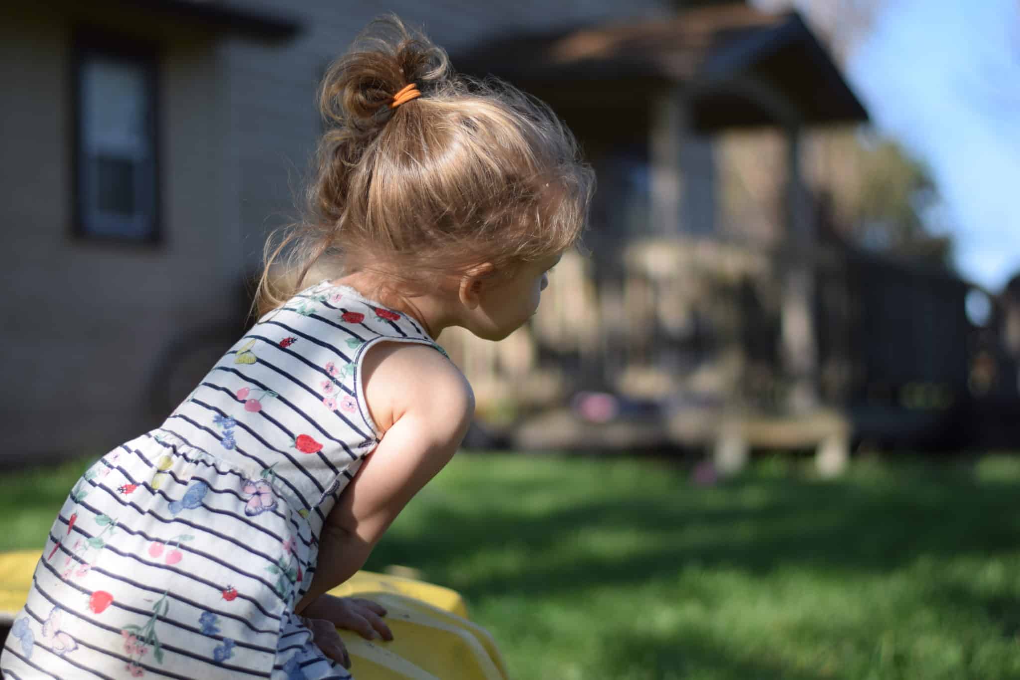 little girl playing outside