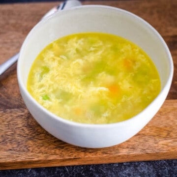 close up of the egg drop soup recipe in a white bowl