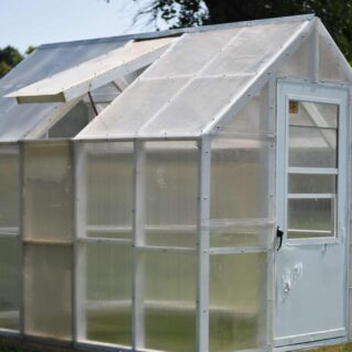 image of greenhouse with white door