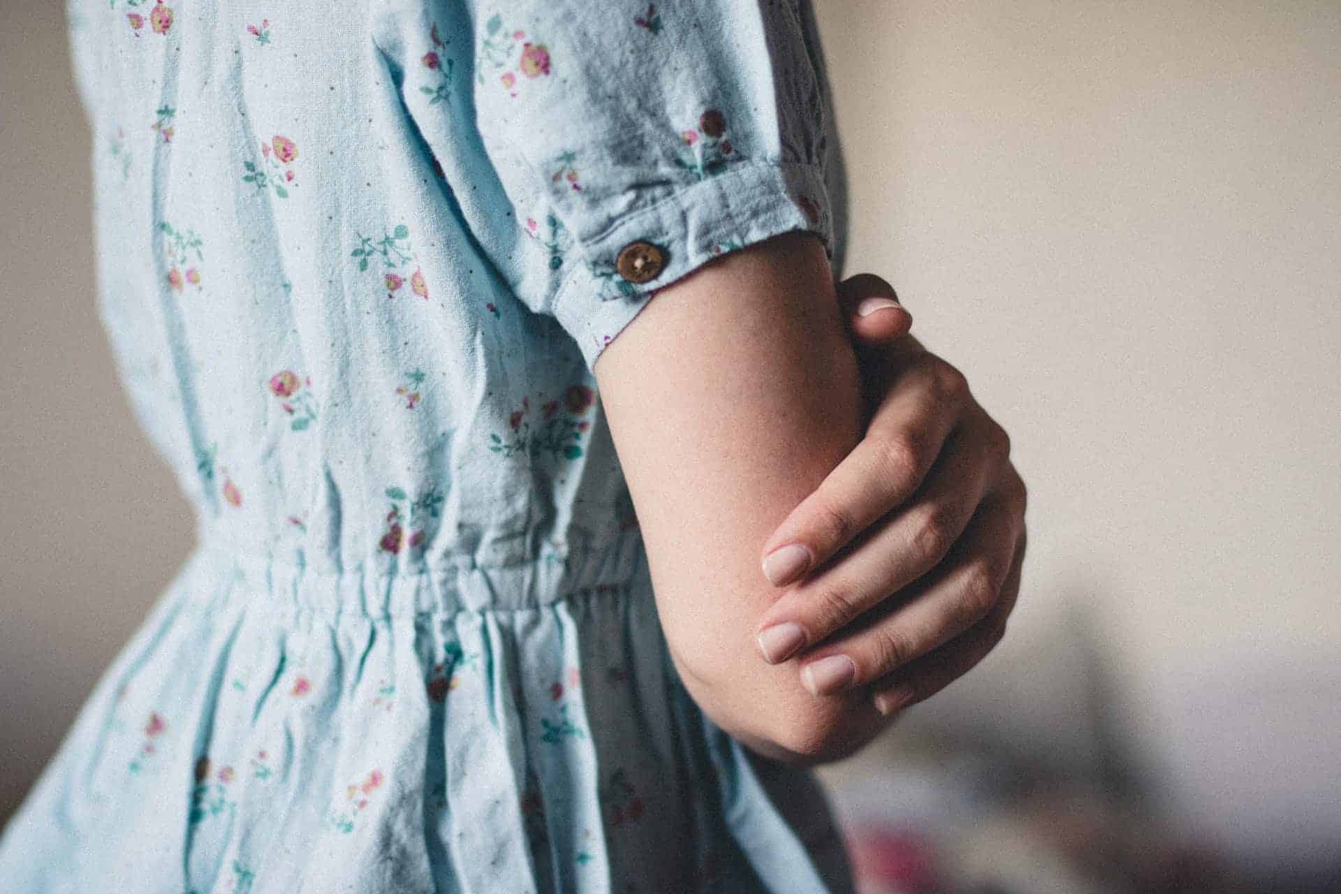 lady wearing light blue dress with pink florals