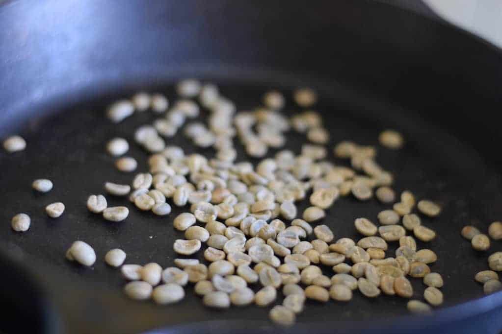 coffee beans in a cast iron skillet