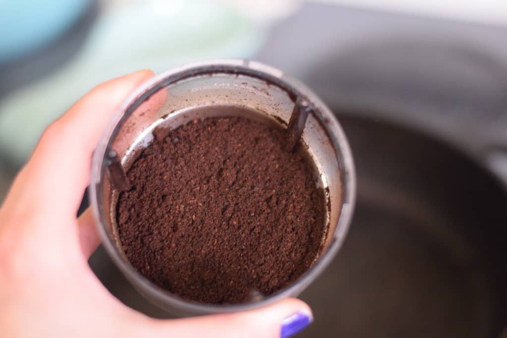 freshly ground coffee in a grinder