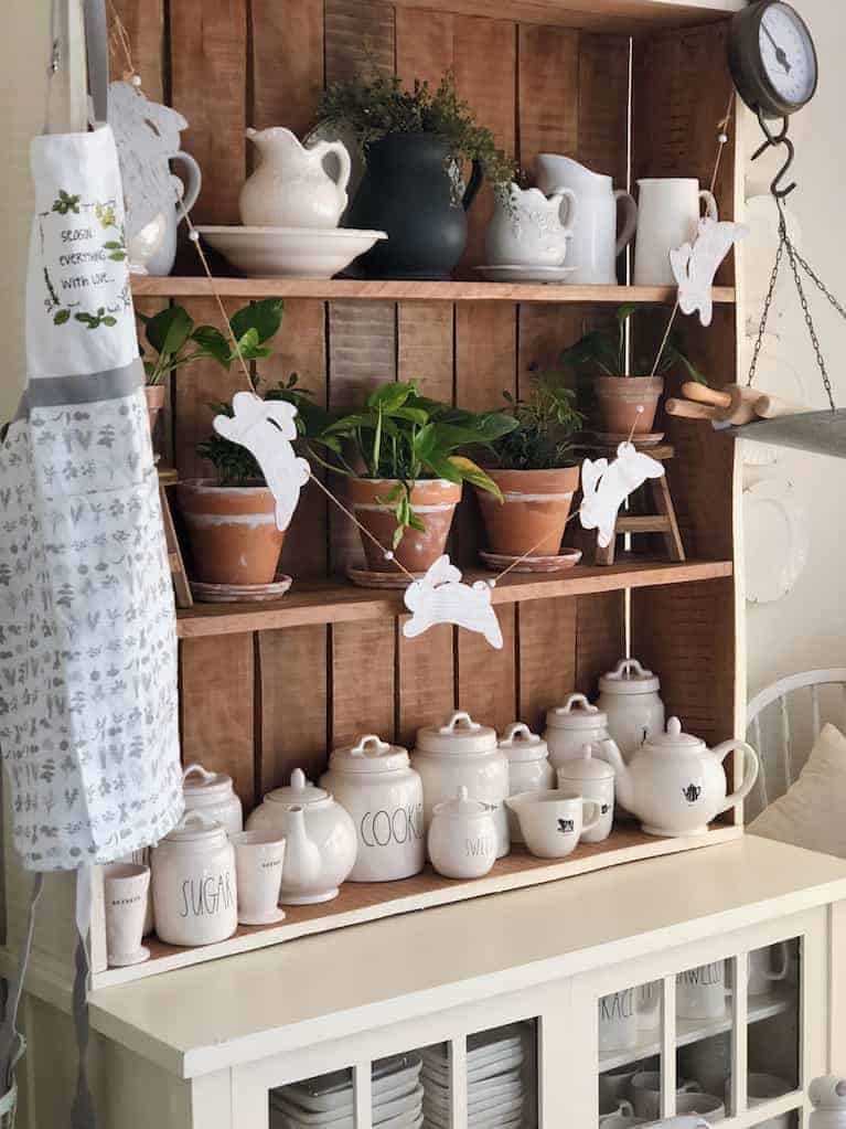 terra cotta pots displayed on rustic farmhouse shelving