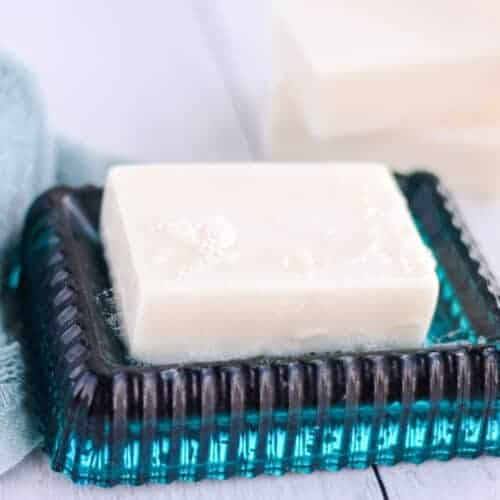 goat milk soap bar on a blue soap dish