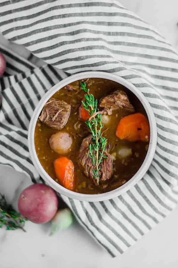 Birdseye view of beef stew in a white bowl