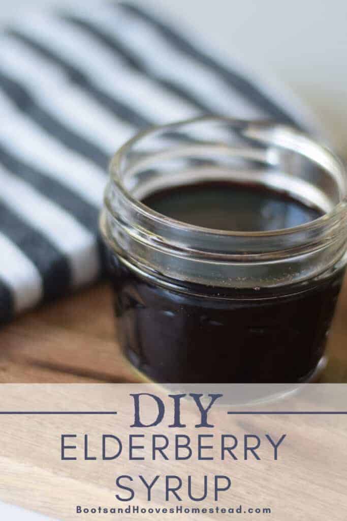 small mason jar of homemade elderberry syrup