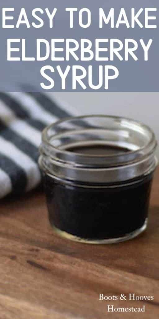 elderberry syrup in glass mason jars and on a wooden cutting board