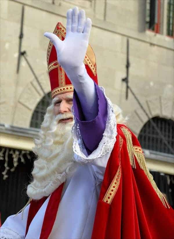 man dressed up in a bishops costume for a parade to celebrate St Nicholas day