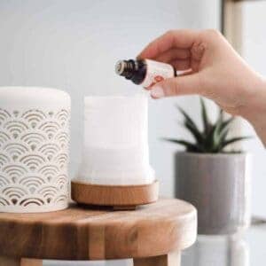 using essential oils in a pretty white diffuser