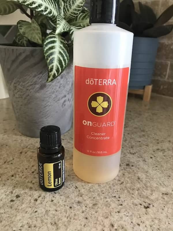lemon essential oil, on guard cleaning concentrate on counter top