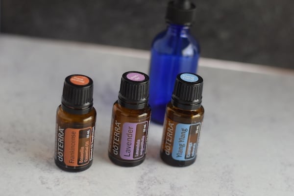 essential oils and blue dropper bottle