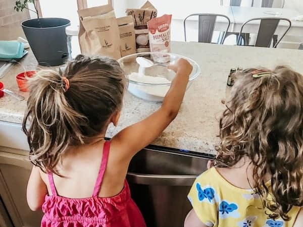 girls helping mix up the laundry detergent