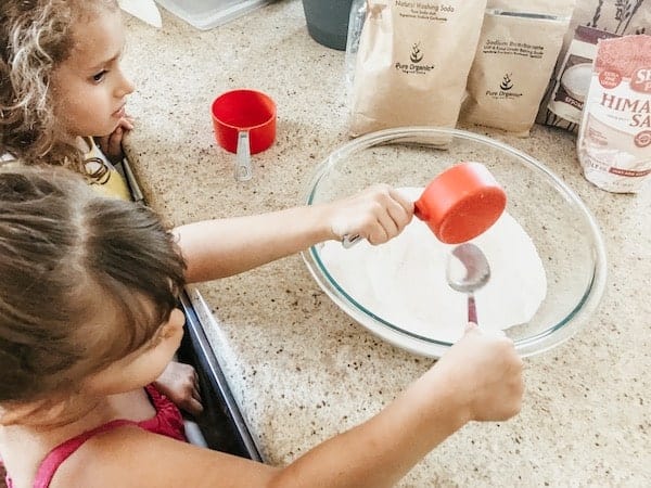 girls mixing up the laundry detergent