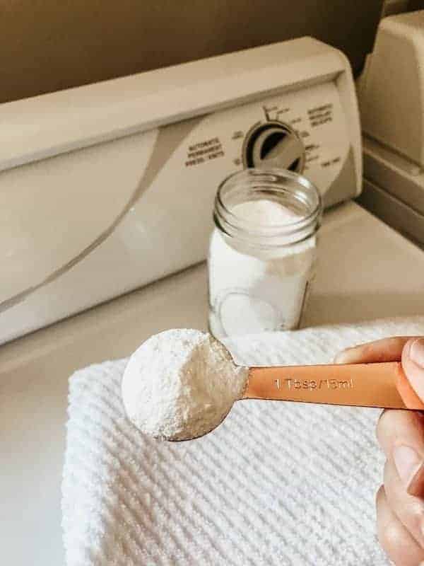 laundry detergent in mason jar, with measuring spoon