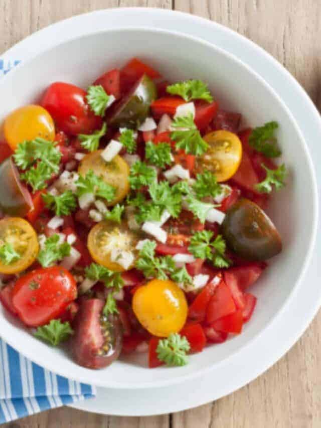 fresh tomato salad in a white bowl
