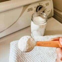 homemade laundry detergent in a mason jar with a measuring spoon
