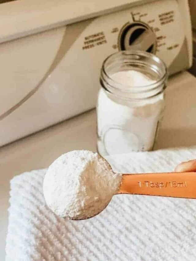 homemade laundry detergent in a mason jar with a measuring spoon