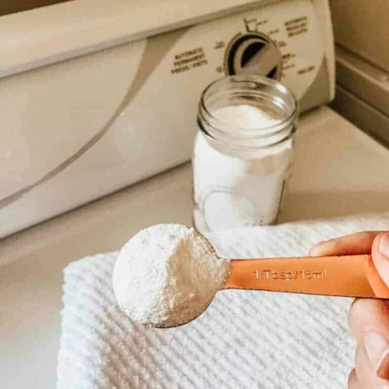 homemade laundry detergent in a mason jar with a measuring spoon