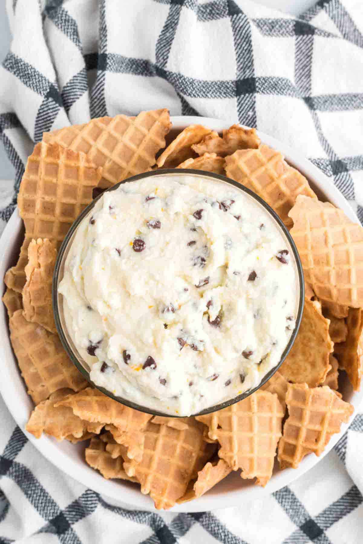 bowl with the cannoli cream and sugar cookies to the sides.