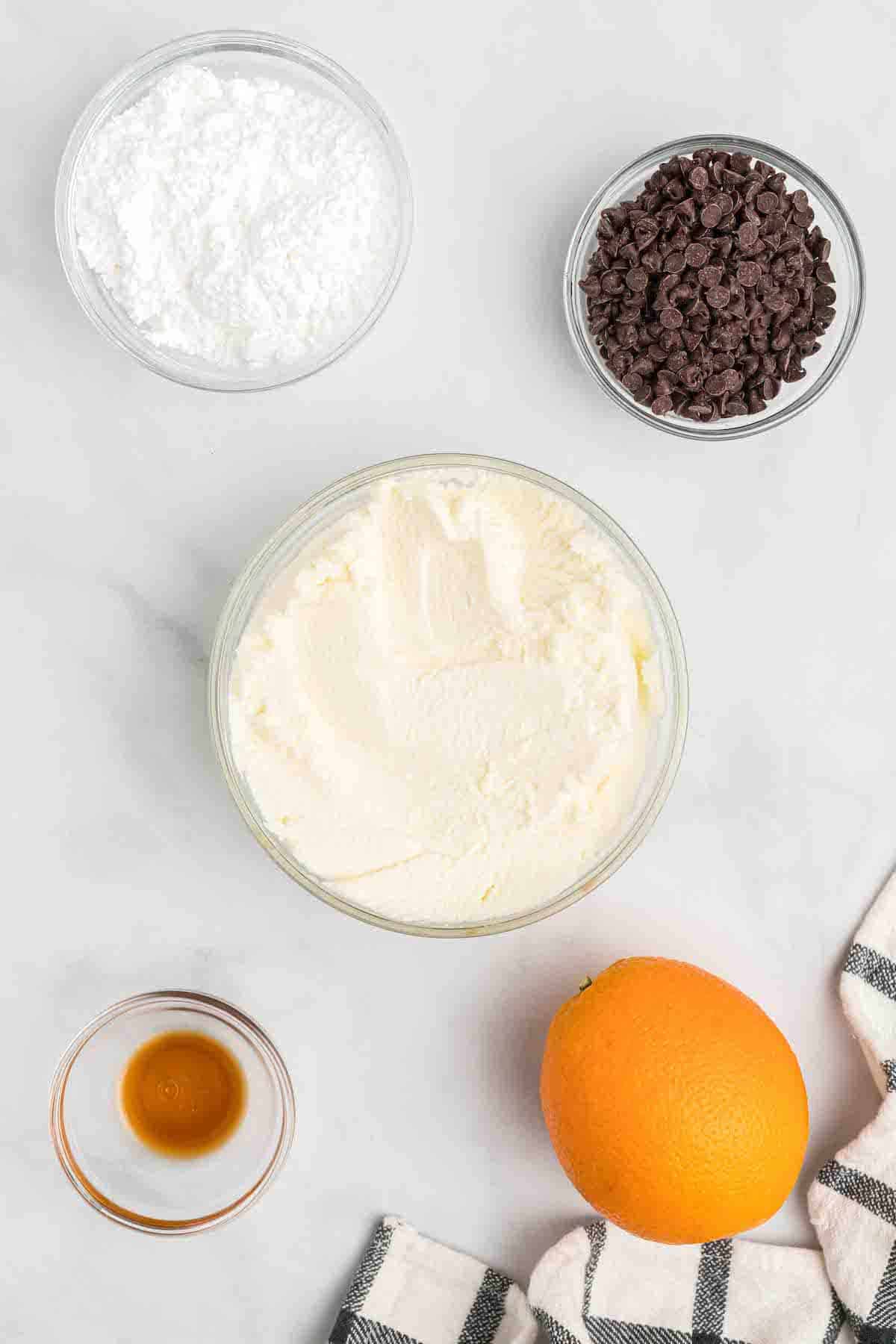 ingredients for the cannoli filling in small bowls