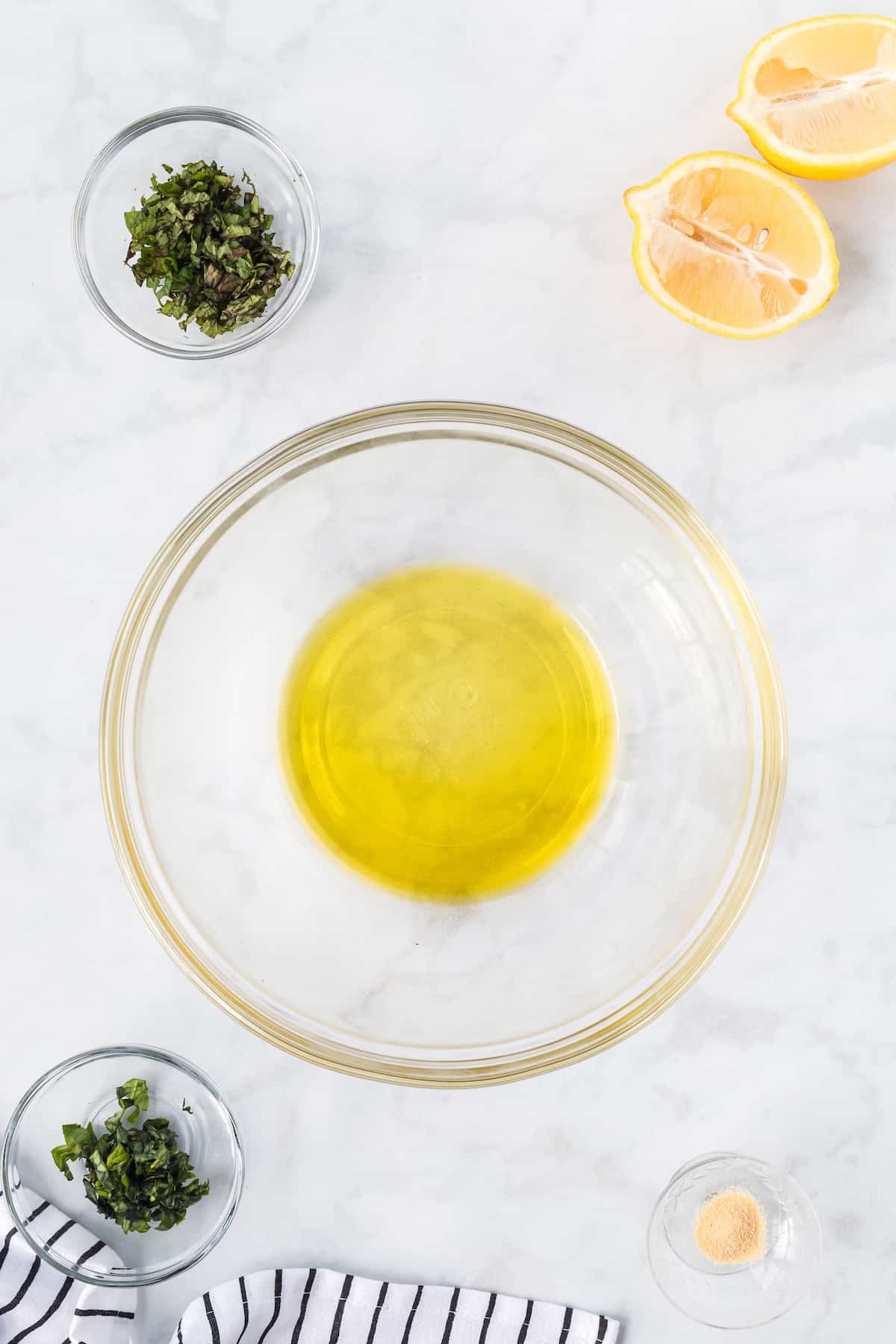 olive oil and lemon juice in a glass bowl 
