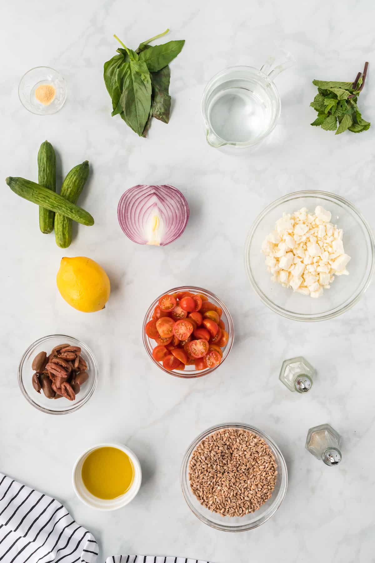 ingredients of the Mediterranean Farro salad in small bowls