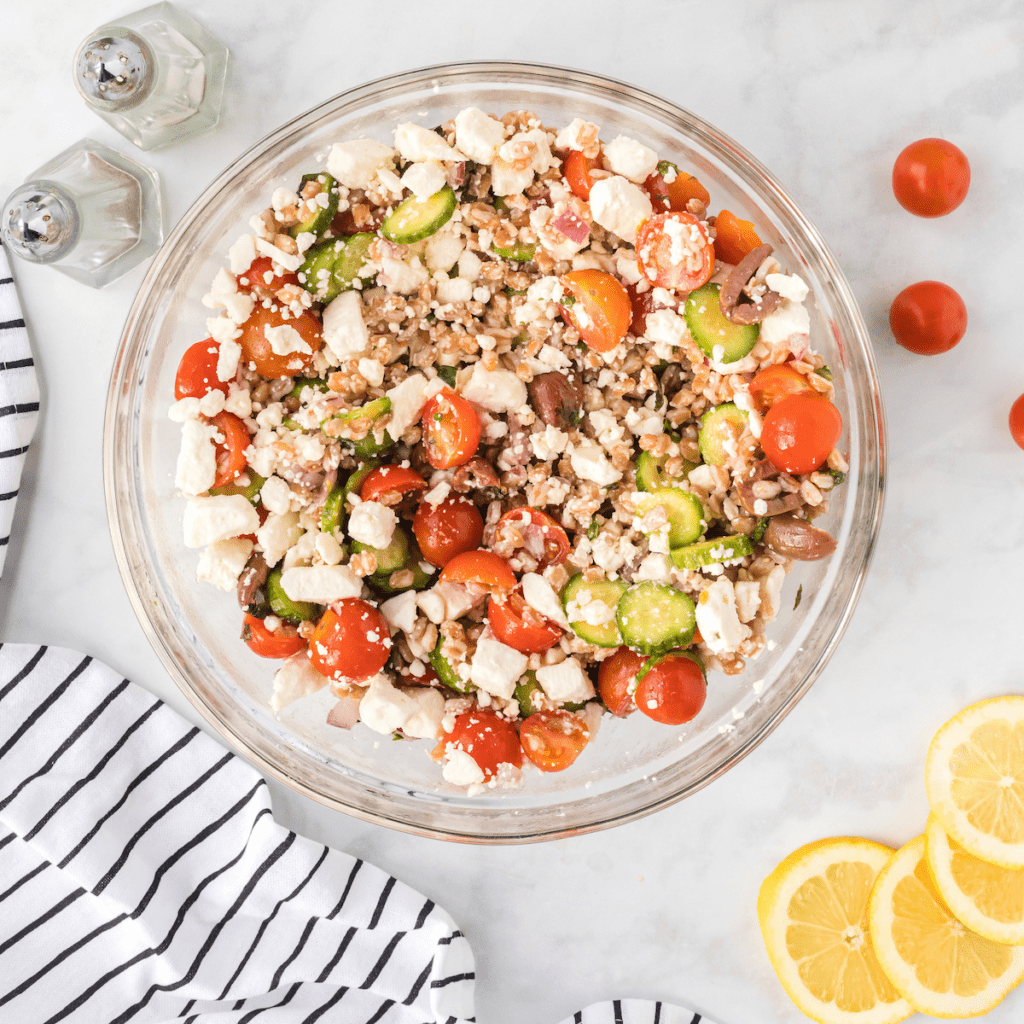 Mediterranean Farro salad with slices of lemon and salt & pepper shakers