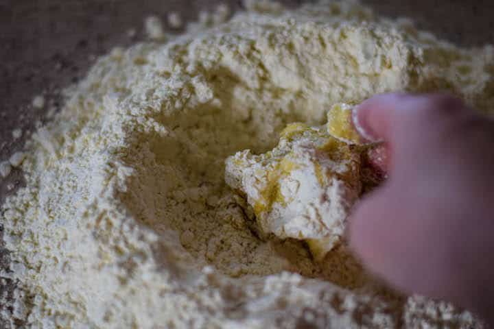 adding in wet ingredients for the dough