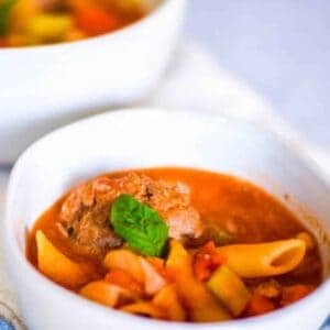 meatball soup in white bowls
