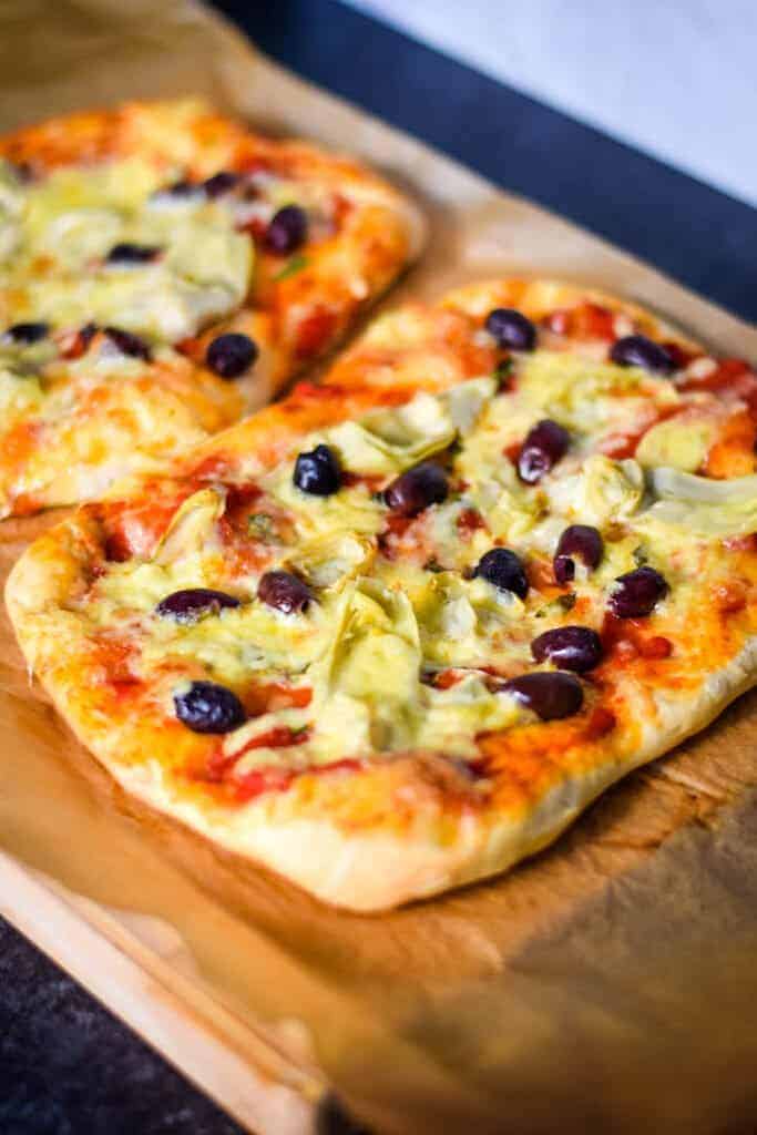 olive and artichoke pizza out of the oven