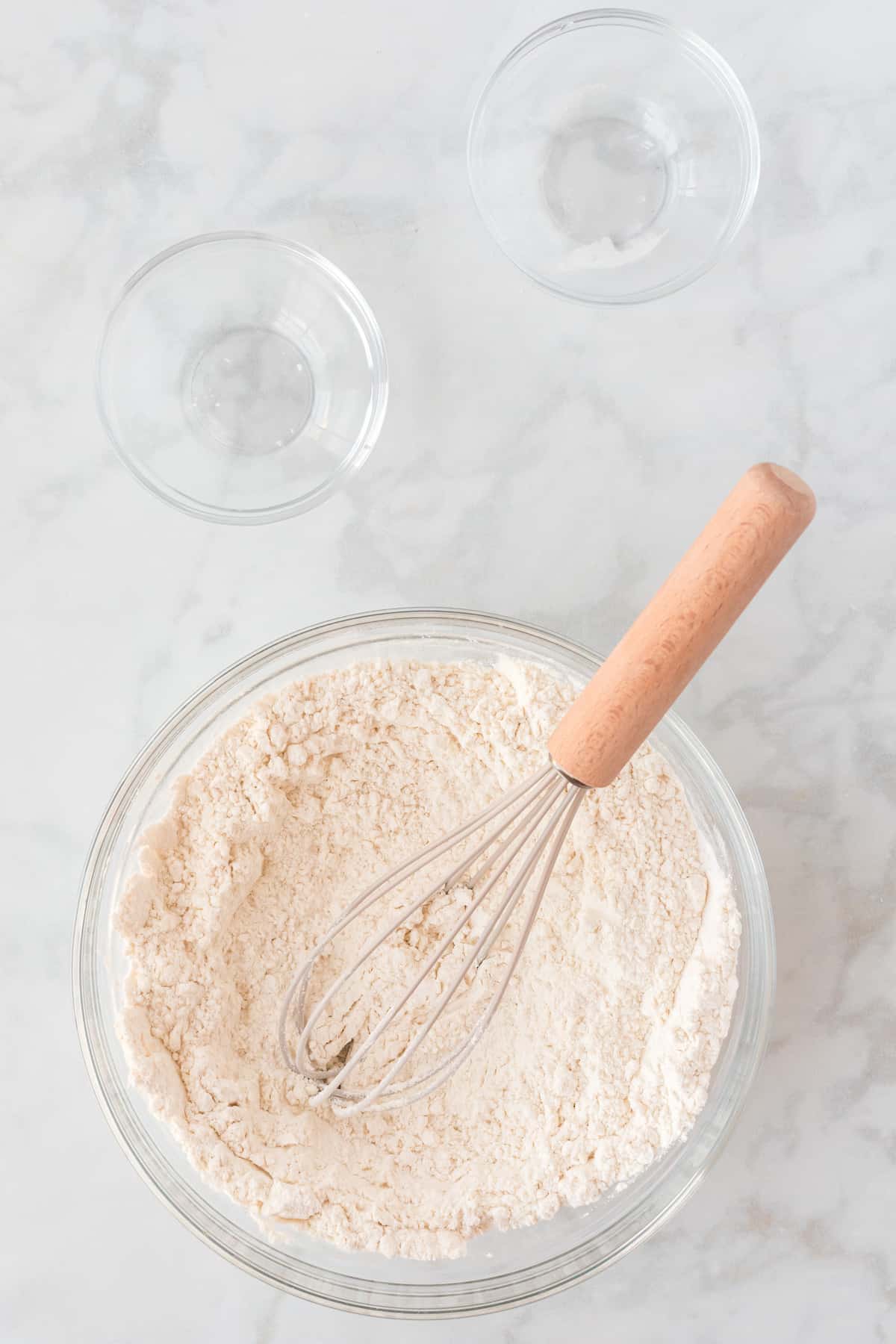 whisking the dry ingredients together in a large glass bowl