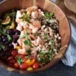 Mediterranean grain bowl with wooden spoons