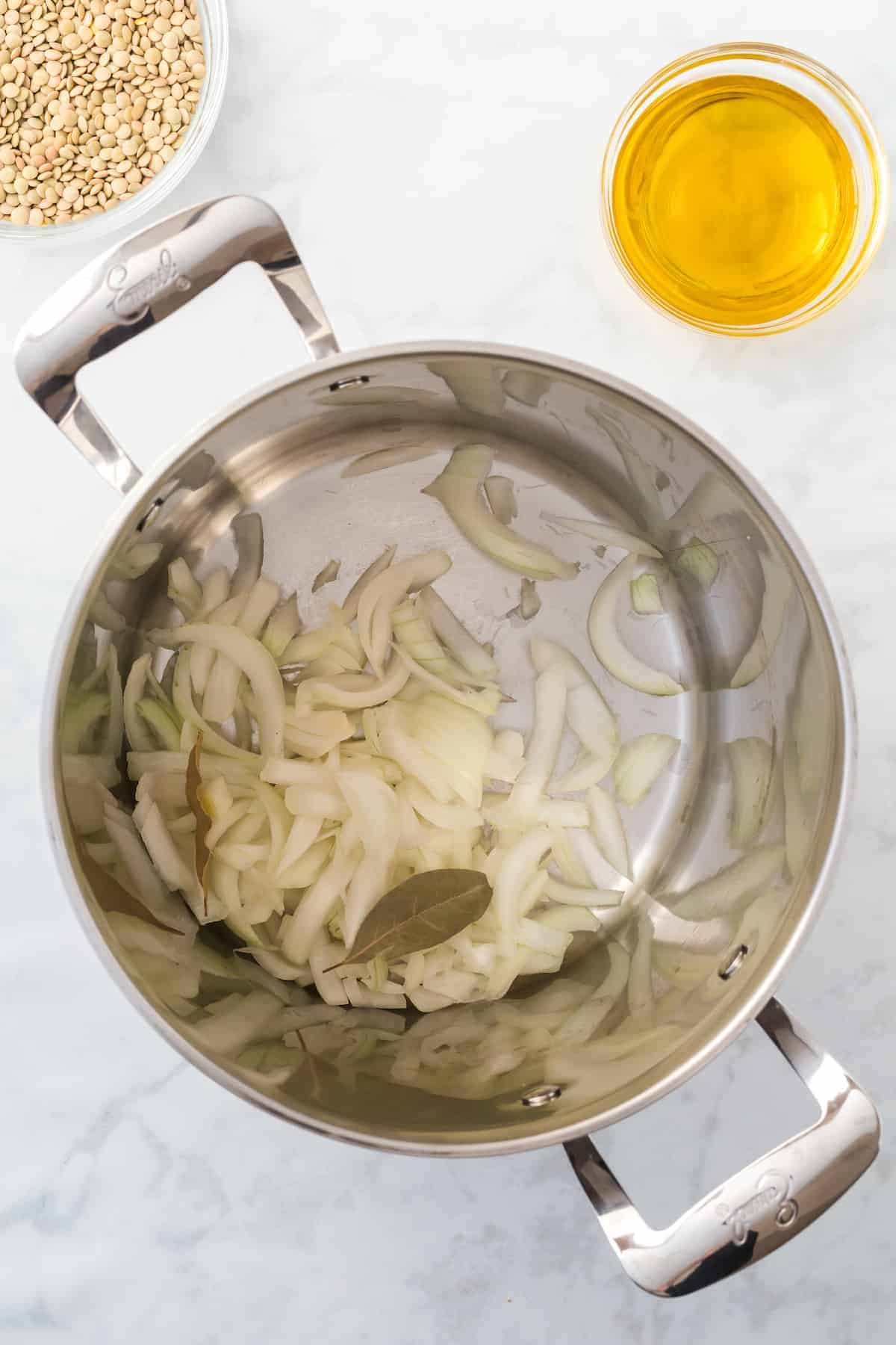 onions and bay leaves in the stock pot