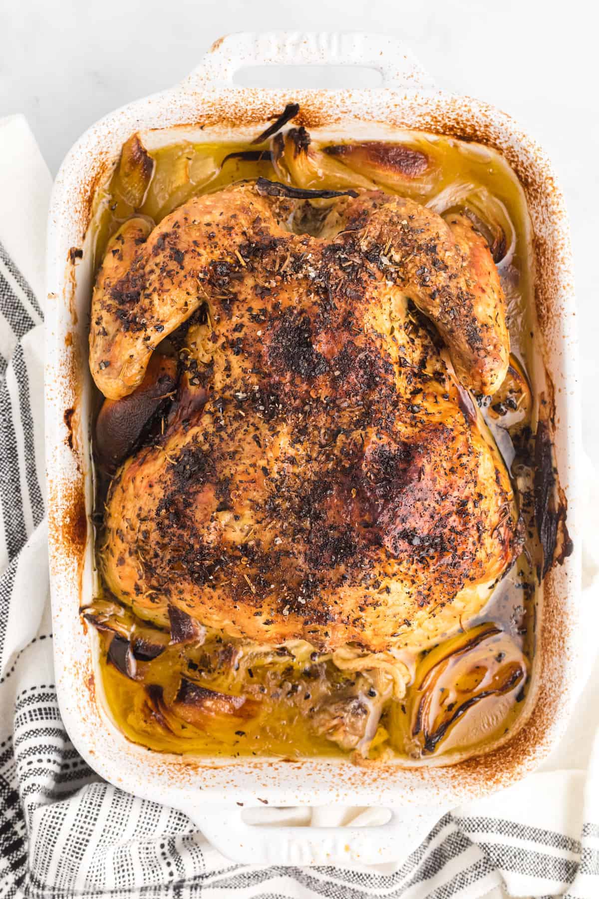 roasted italian chicken in the white baking dish