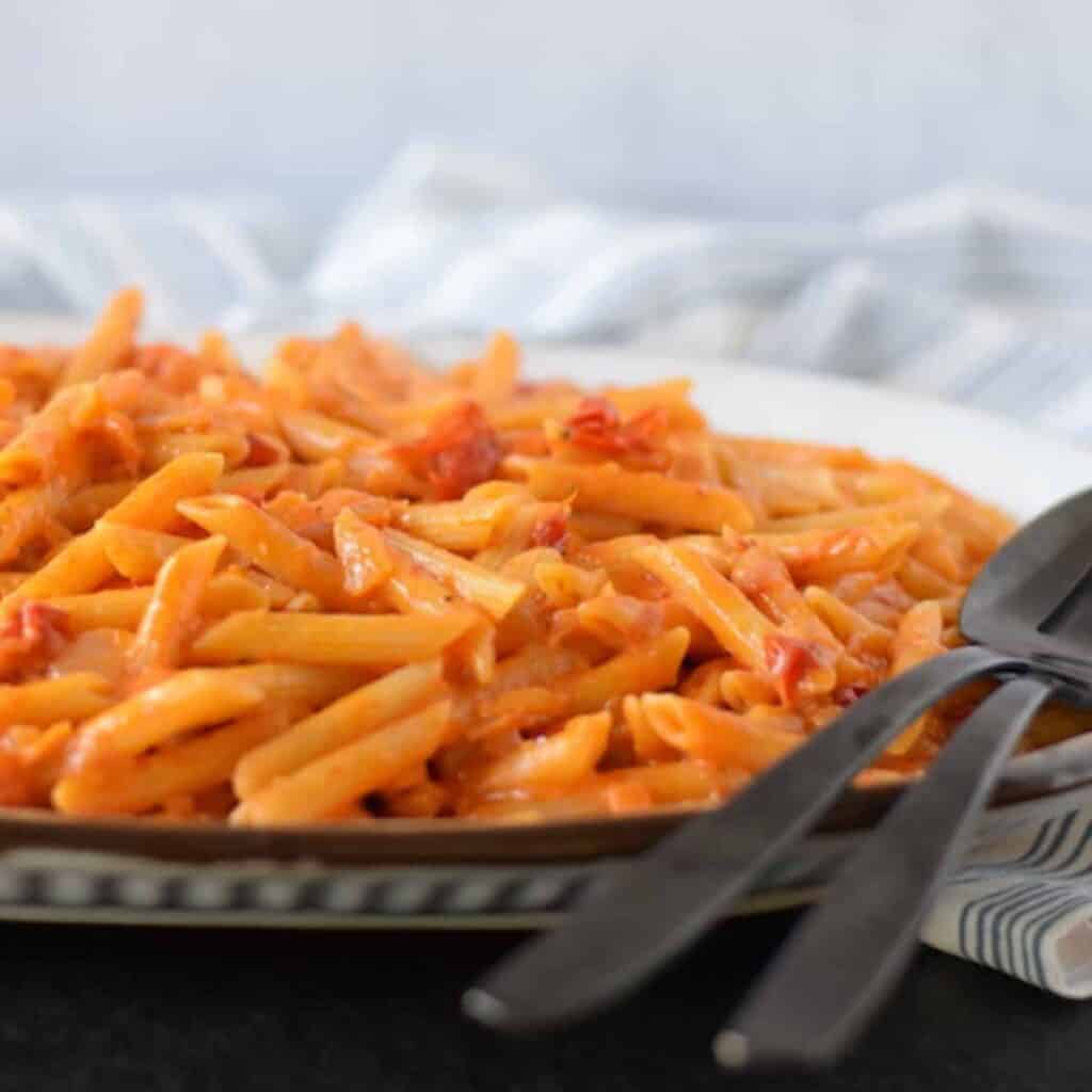 creamy pomodoro sauce with pasta on platter