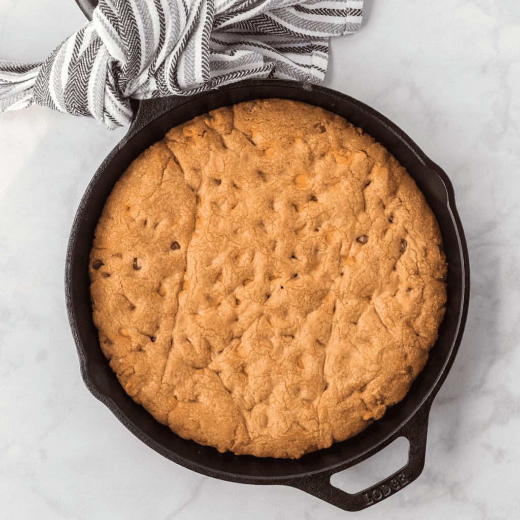 cast iron skillet with large chocolate chip and peanut butter chip cookie
