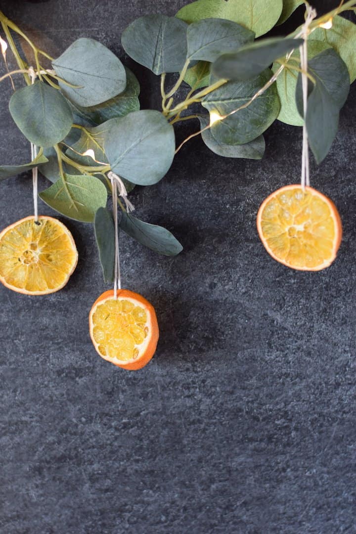 christmas decor dried oranges hanging on a string