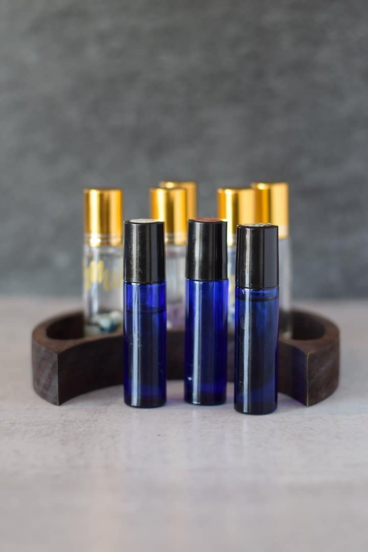 essential oil roller bottles on table