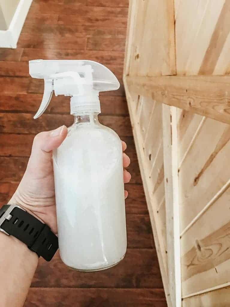homemade leave in conditioner in a glass spray bottle