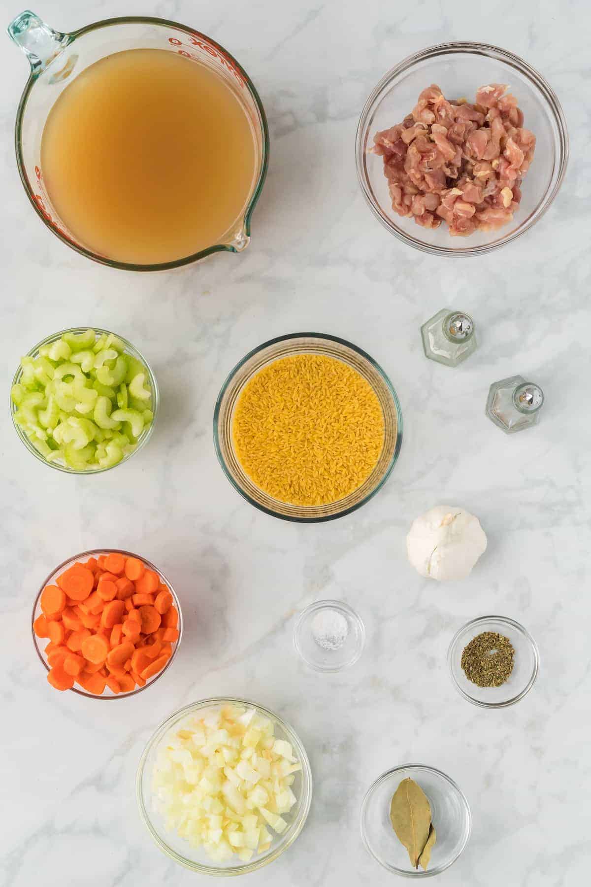 ingredients for the chicken soup in small glass bowls