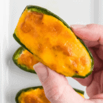 holding a finished jalapeno popper close up to see the texture.