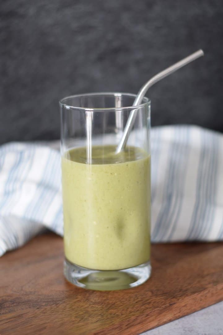 morning smoothie in a glass with stainless steel straw