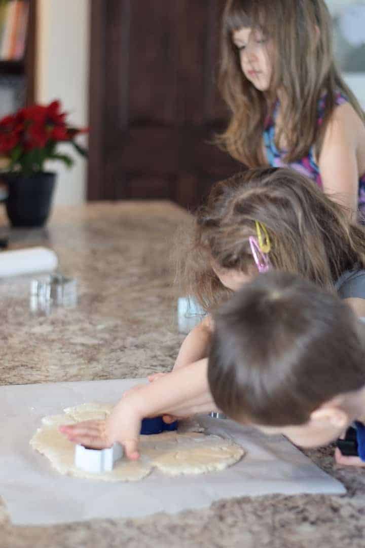 children making ornaments with cookie shapes